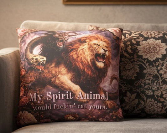 Gray sofa with decorative pillows, including one with a lion design and text.