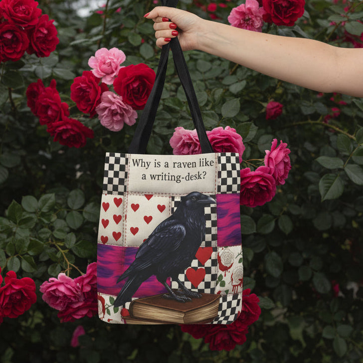 Tote bag with a raven design and text, held by a hand on a white background
