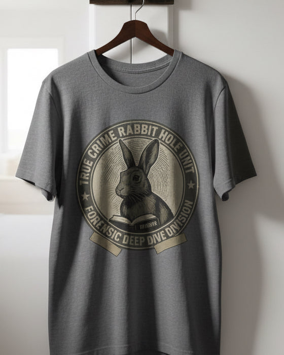 Gray t-shirt with rabbit graphic and text on a wooden chair against a gray background